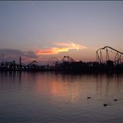 Picture Of Carousels At Amusement Park At Dusk